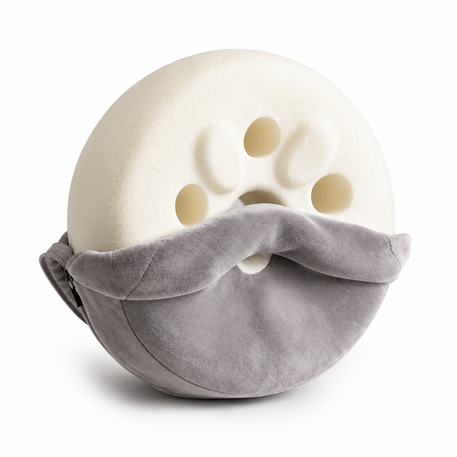 knēNest memory foam core with its removable soft gray cover partially unzipped